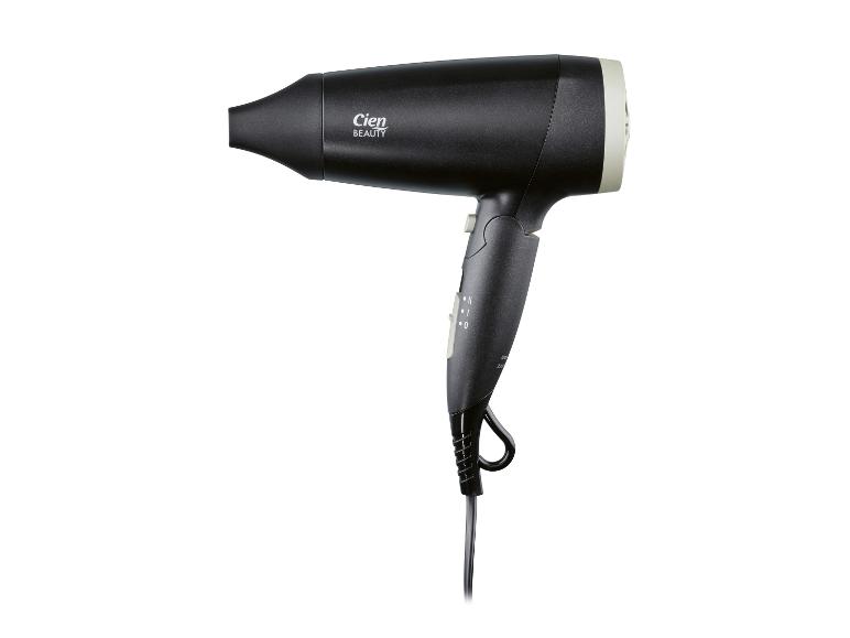 Sèche-cheveux noir avec détails beiges et boutons de commande.