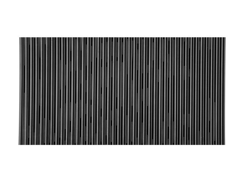 Un motif noir et blanc de rayures verticales.