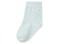 Une chaussette bleu clair, isolée sur un fond blanc.