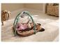 Bébé allongé sur un tapis d'éveil LUPILU® avec arche et jouets suspendus.