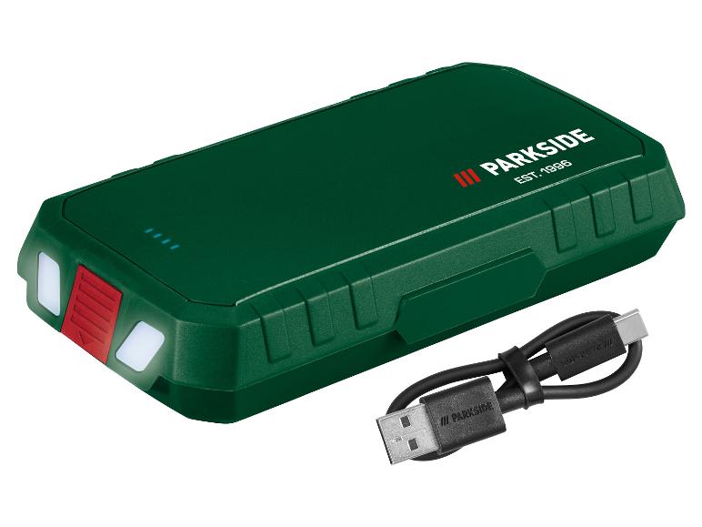 Batterie externe verte avec lampe de poche et câble USB-C.