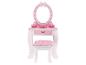 Une coiffeuse rose avec miroir et chaise pour petites filles.