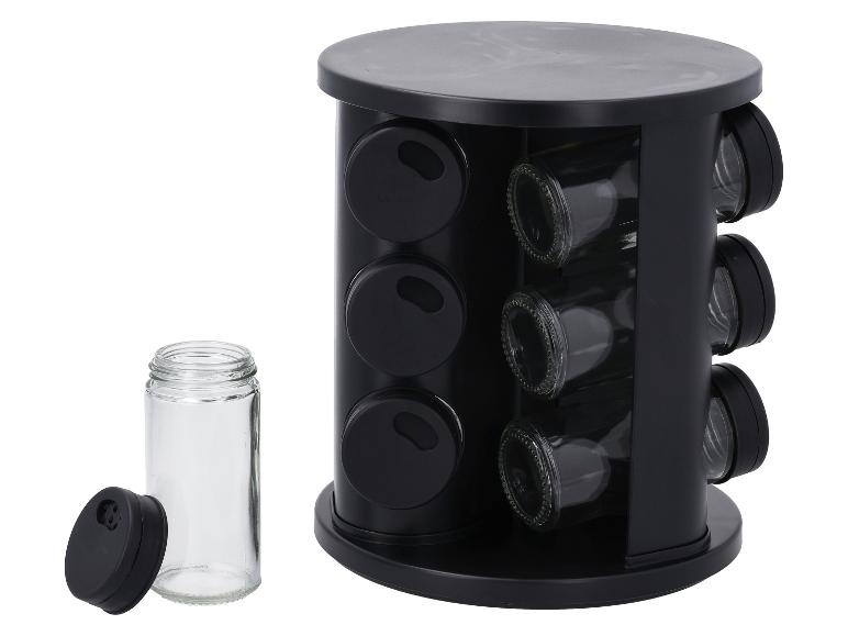 Support à épices rotatif noir avec bocaux en verre vides, un bocal avec couvercle détaché.
