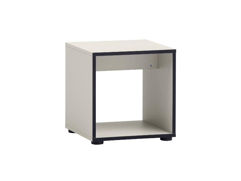 Petite étagère cube beige avec des bords et des pieds noirs.
