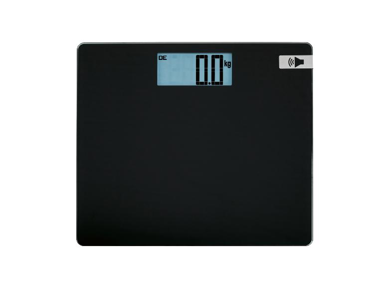 Pèse-personne noir avec affichage numérique indiquant « 0.0 kg » et une icône de haut-parleur