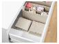 Boîtes de rangement textiles beige pour tiroirs, idéal pour vêtements pliés.