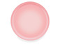 Une assiette rose pour servir de la nourriture.