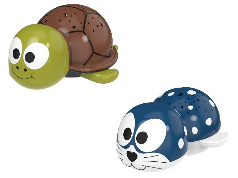 Deux veilleuses en forme d'animaux : une tortue verte et un phoque bleu.