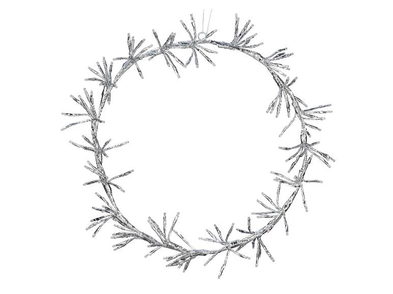 Couronne lumineuse argentée à l'aspect épineux sur fond blanc