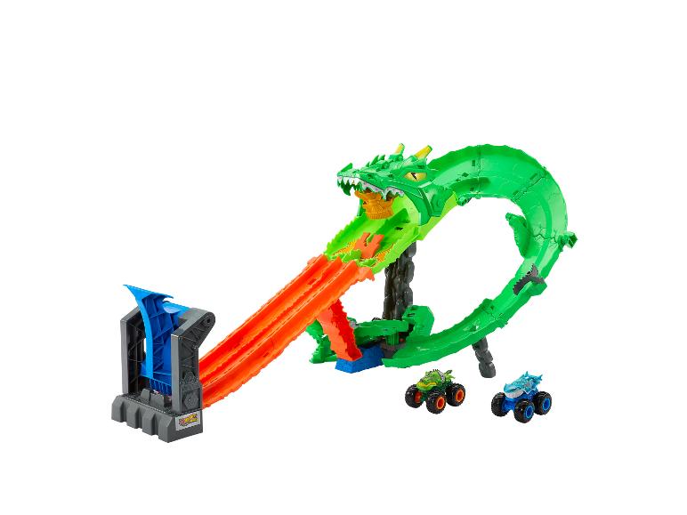 Piste de monster truck dragon vert avec deux monster trucks.