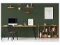 Bureau avec ordinateur, chaise et étagères en bois sur un mur vert foncé.
