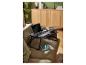 Table pour ordinateur portable noire LIVARNO home sur un canapé avec ordinateur, souris et verre.