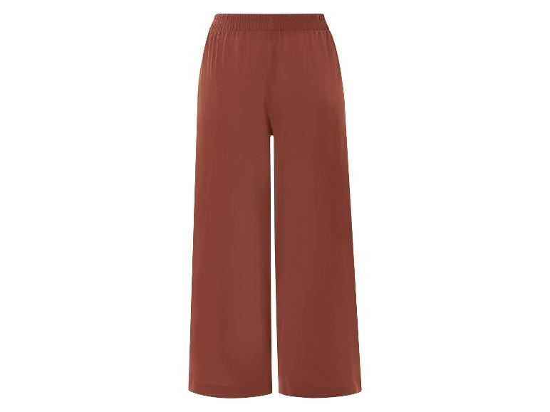 Pantalon large brun rouille, coupe ample.