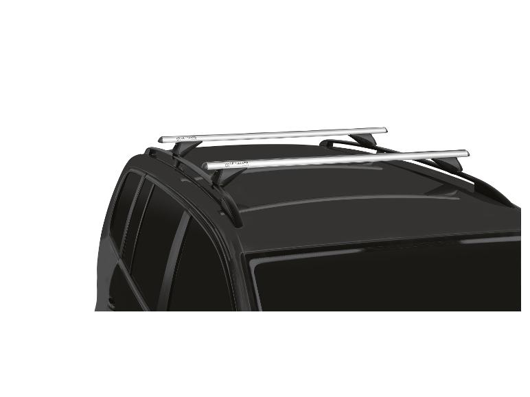 Barres de toit argentées montées sur une voiture noire, vues sous un angle.