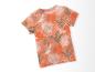 T-shirt enfant, motif tropical, feuilles oranges et vertes.