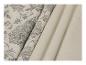 Deux rouleaux de tissu, l'un avec un motif floral gris et l'autre beige uni.