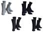 Quatre paires de chaussettes Scholl, deux grises et deux noires.