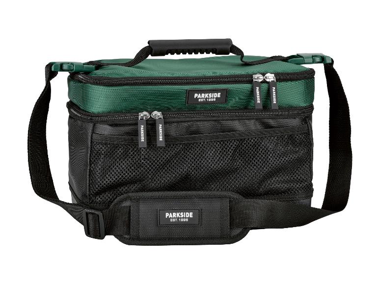 Sac isotherme vert et noir avec deux compartiments zippés et une bandoulière réglable.