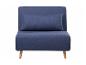 Fauteuil convertible bleu marine avec coussin.