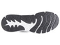 La semelle d'une sneaker noire avec un accent blanc.