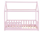 Un lit pour enfant rose avec un baldaquin et une barrière.