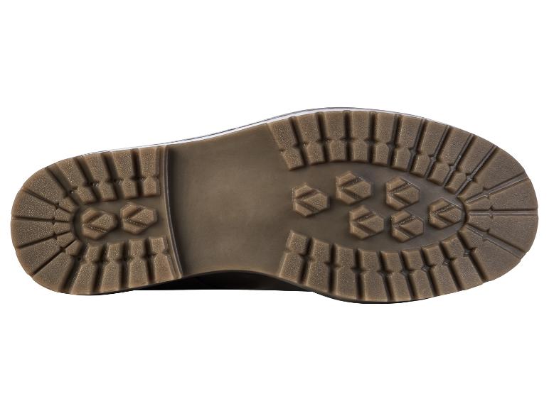 La semelle d'une chaussure brune avec une bande de roulement rugueuse.