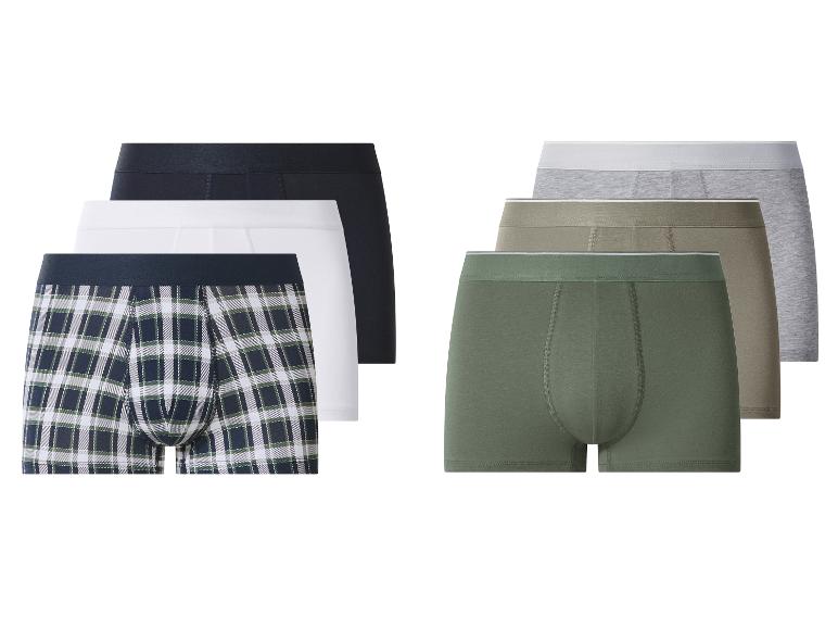 Cinq boxers en coton : un à carreaux, un blanc, un noir, un kaki et un vert.