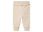 Pantalon en tricot beige pour bébé.
