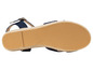 La semelle d'une espadrille bleu marine avec une sangle en cuir.