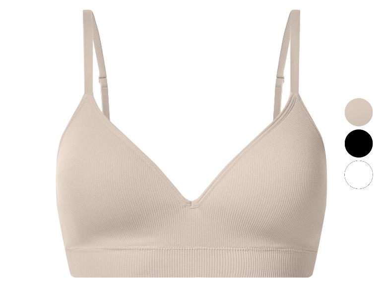 Soutien-gorge côtelé sans couture beige avec bretelles réglables.