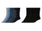 Un ensemble de chaussettes noires et de chaussettes avec différents motifs, dont des pois et des rayures.