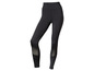 Leggings noirs avec des panneaux en mesh pour le sport.