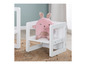 Une chaise d'enfant blanche avec un coussin en forme de lapin rose de la marque roba.