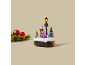Décoration de Noël lumineuse avec le Père Noël, un ourson et un réverbère sur un socle enneigé.