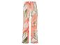 Pantalon large à motif floral corail et vert.