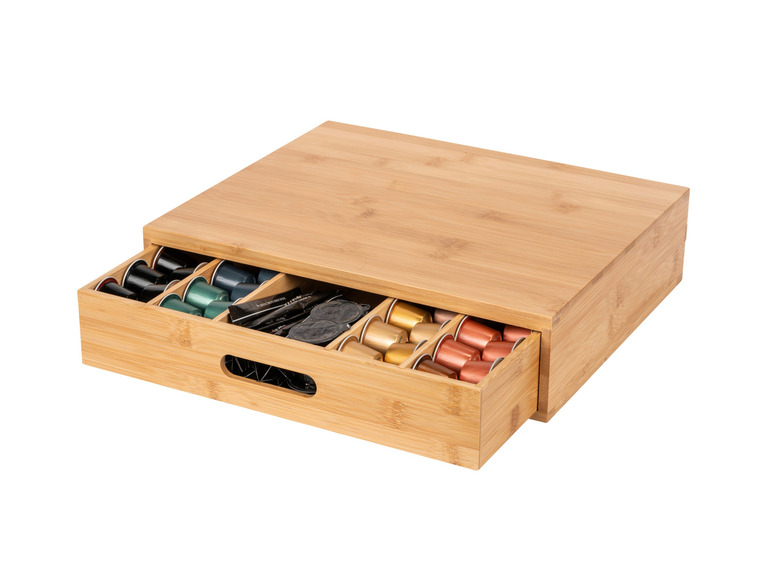 Un boîte de rangement en bambou avec tiroir pour capsules Nespresso