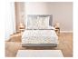 Parure de lit fleurie : drap, taies d'oreiller.