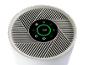 Gros plan sur le panneau de commande d'un purificateur d'air blanc avec écran rond.
