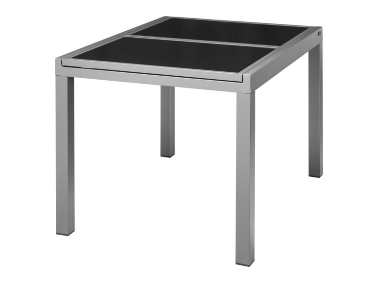 Une table argentée avec un plateau en verre noir.
