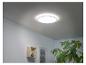 Un luminaire de plafond rond avec une étagère en bois sur le mur.