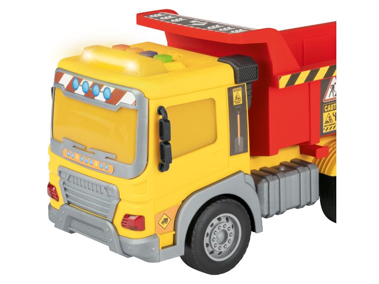 Camion jouet jaune et rouge avec lumières allumées