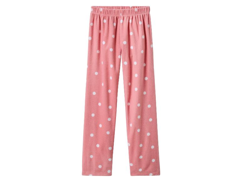 Pantalon de pyjama rose à pois blancs.