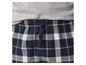 Pantalon de pyjama à carreaux bleus avec cordon de serrage.