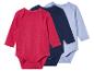 Trois bodys bébé manches longues de couleurs différentes.