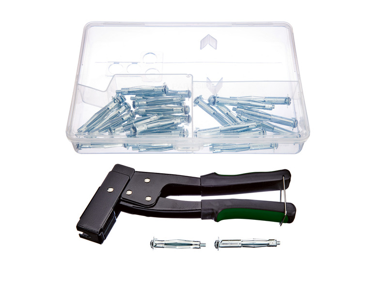 Un ensemble avec un pistolet pour chevilles et chevilles dans une boîte.