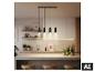 Suspension LED noire BRILONER à quatre lampes au-dessus d'un îlot de cuisine. [image générée par l'IA]