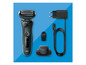 Un rasoir Braun avec accessoires, y compris un chargeur, une brosse et une tête de rasage.