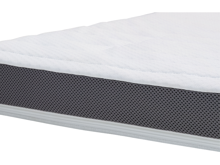 Matelas blanc avec côté en maille.