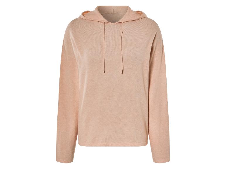 Un sweat-shirt rose à capuche en tricot.