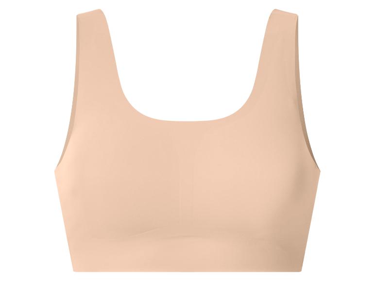 Soutien-gorge de sport beige sans couture pour femme.